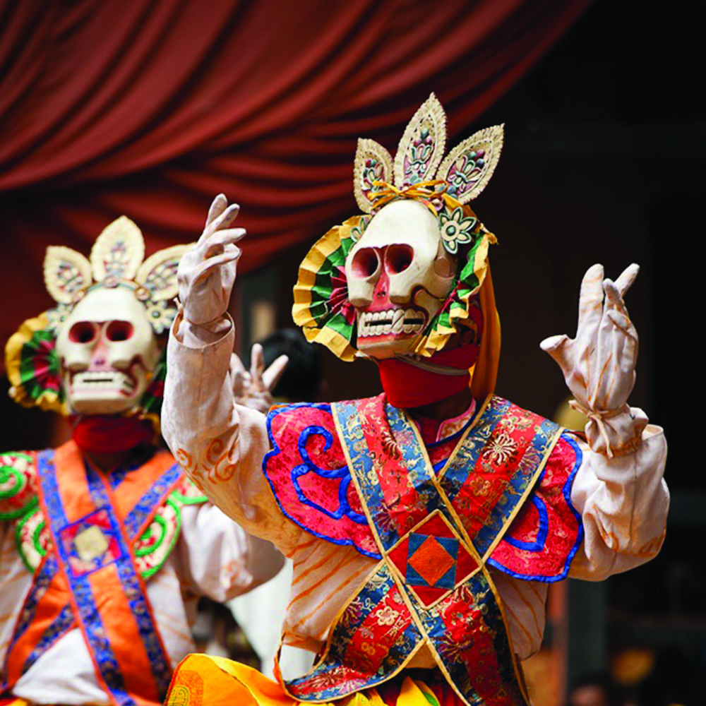 Close view of Bhutanese festival mask dancers